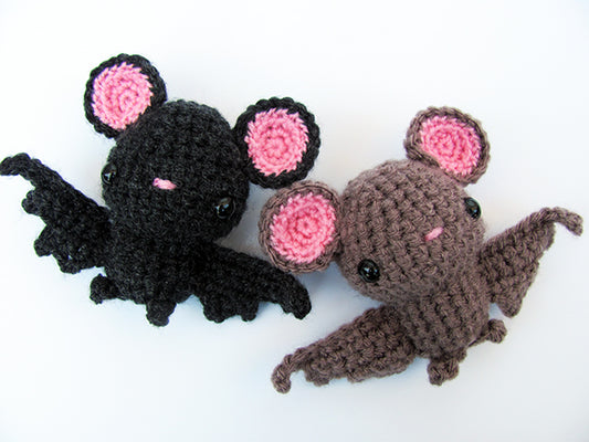amigurumi crochet bat pattern brown and black flying next to each other