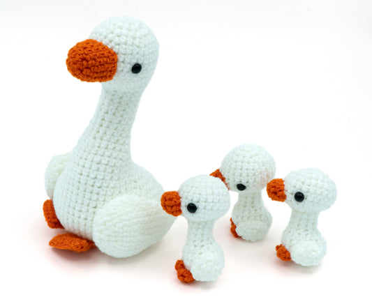 amigurumi crochet goose family pattern mother and goslings following behind