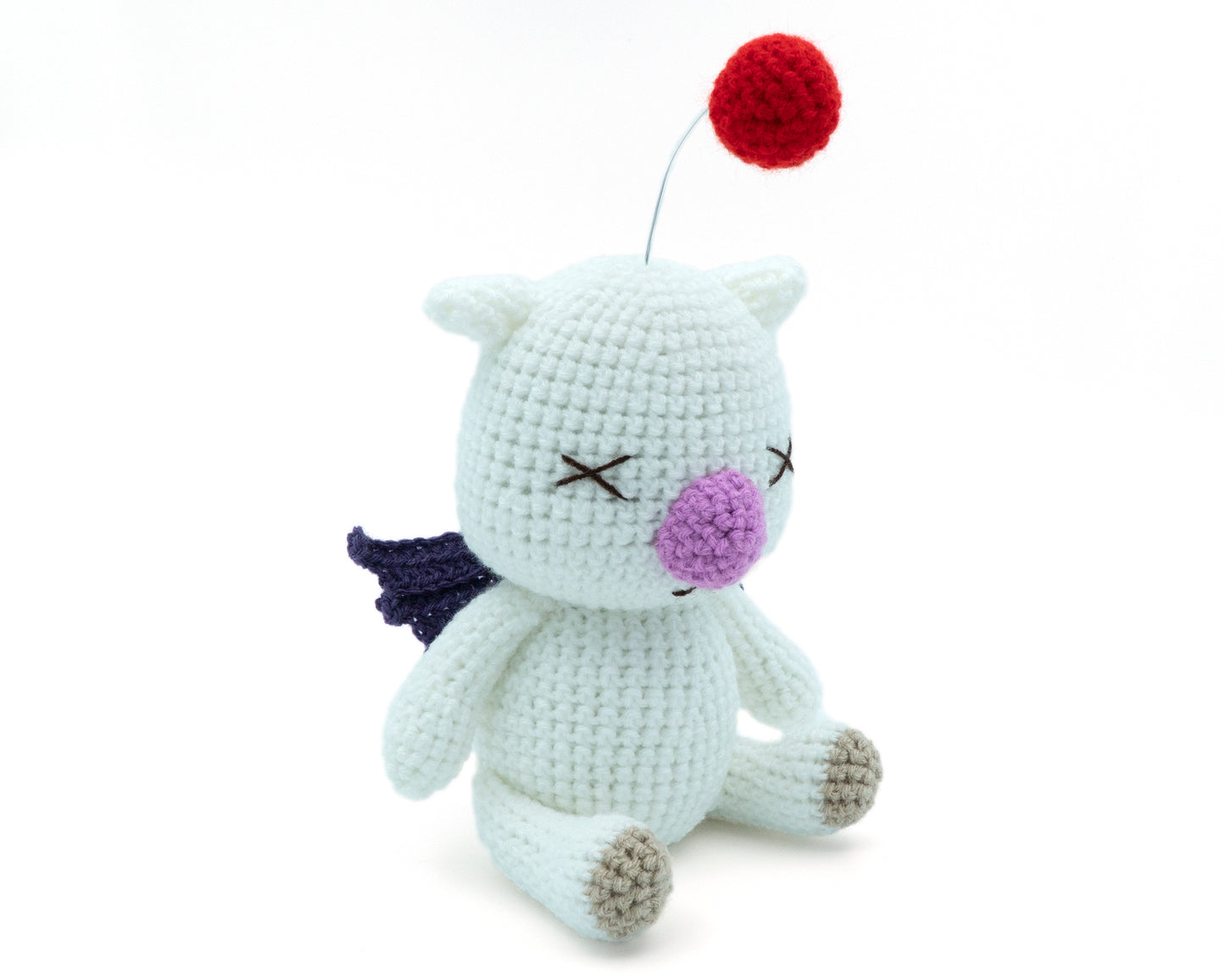 amigurumi crochet final fantasy moogle pattern three quarter view with red pom-pom