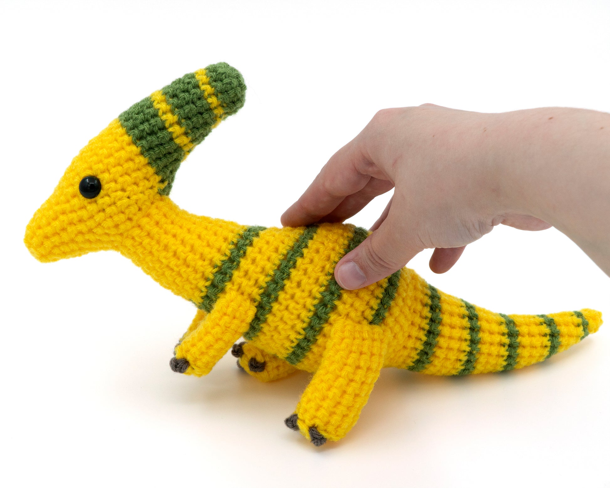 amigurumi crochet parasaurolophus pattern in hand for size comparison