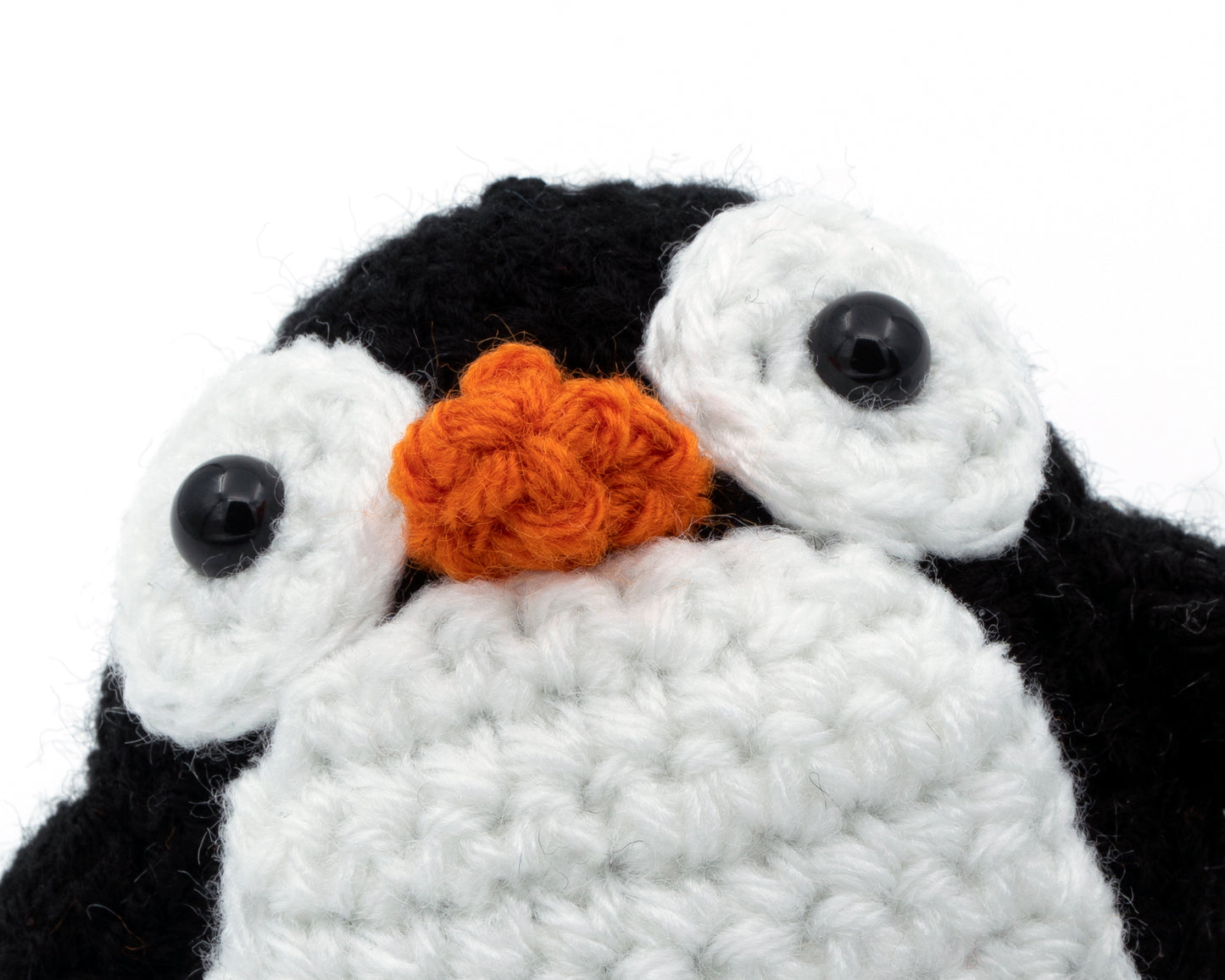 amigurumi crochet penguin pattern close up of googly eyes