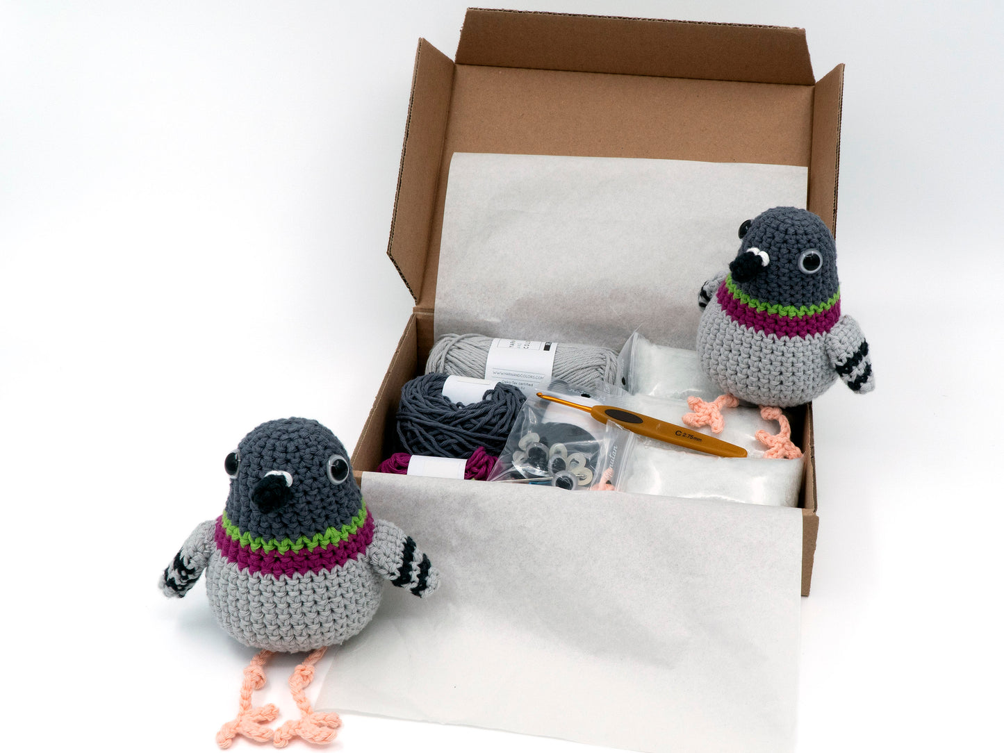 amigurumi crochet pigeon kit two birds sitting inside a box of yarn