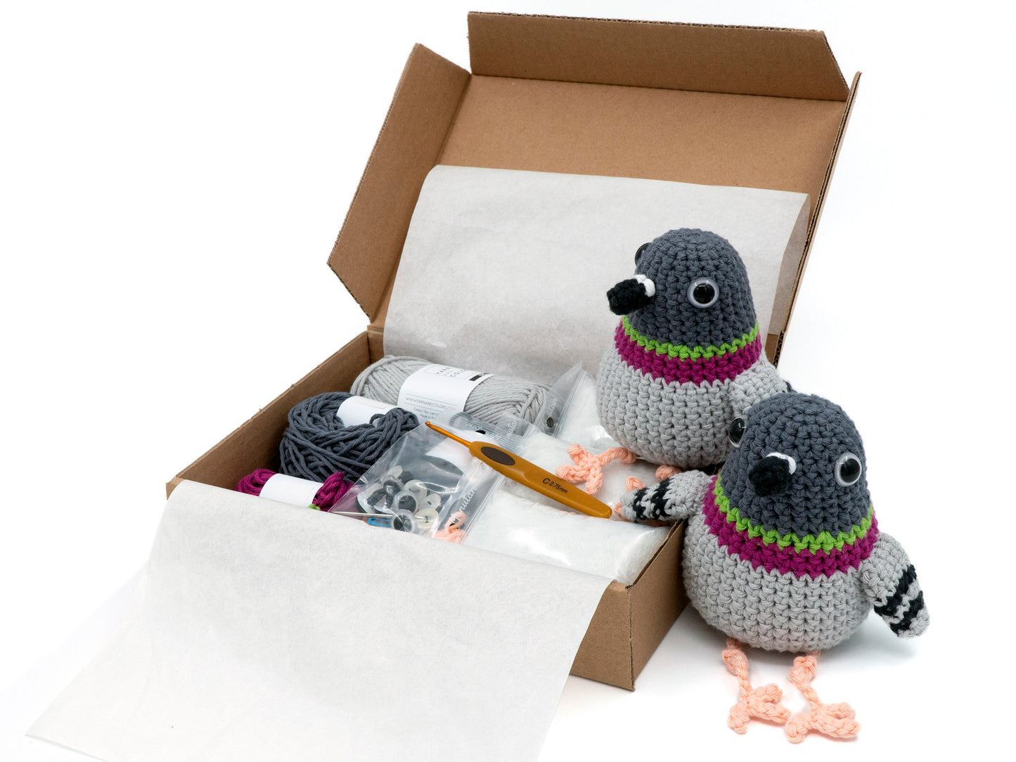 amigurumi crochet pigeon kit two birds sitting next to a box of yarn