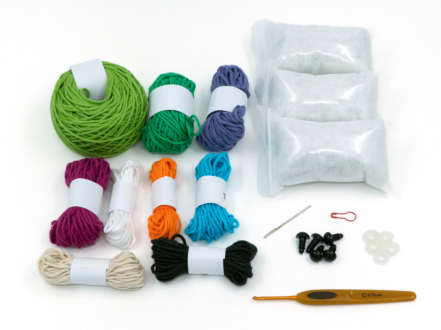 amigurumi crochet plum-headed parakeet kit two parrots close up of the contents of the kit