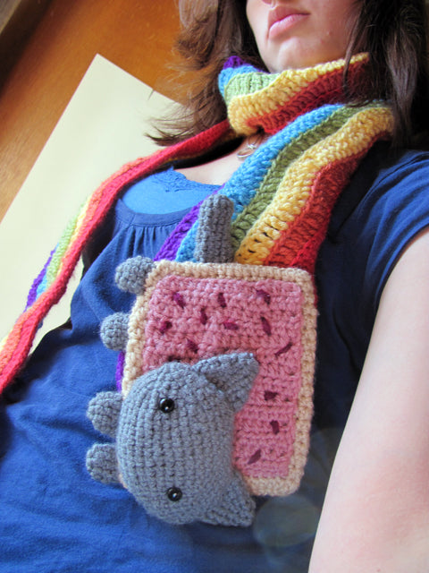 amigurumi crochet nyan cat scarf pattern being worn by model for size comparison