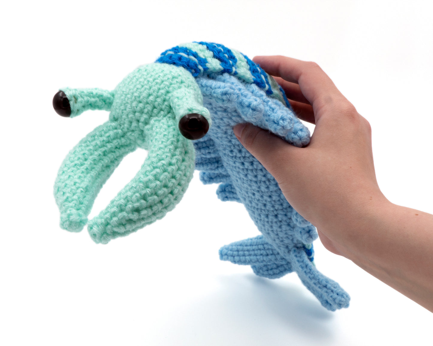amigurumi crochet anomalocaris pattern in hand for size comparison