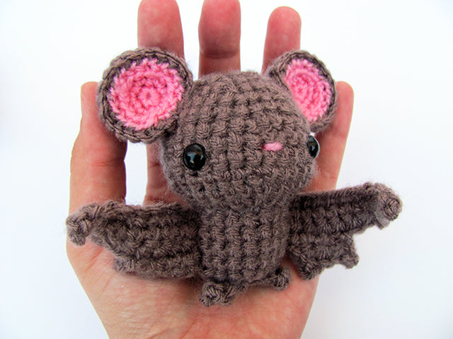 amigurumi crochet bat pattern in hand for size comparison