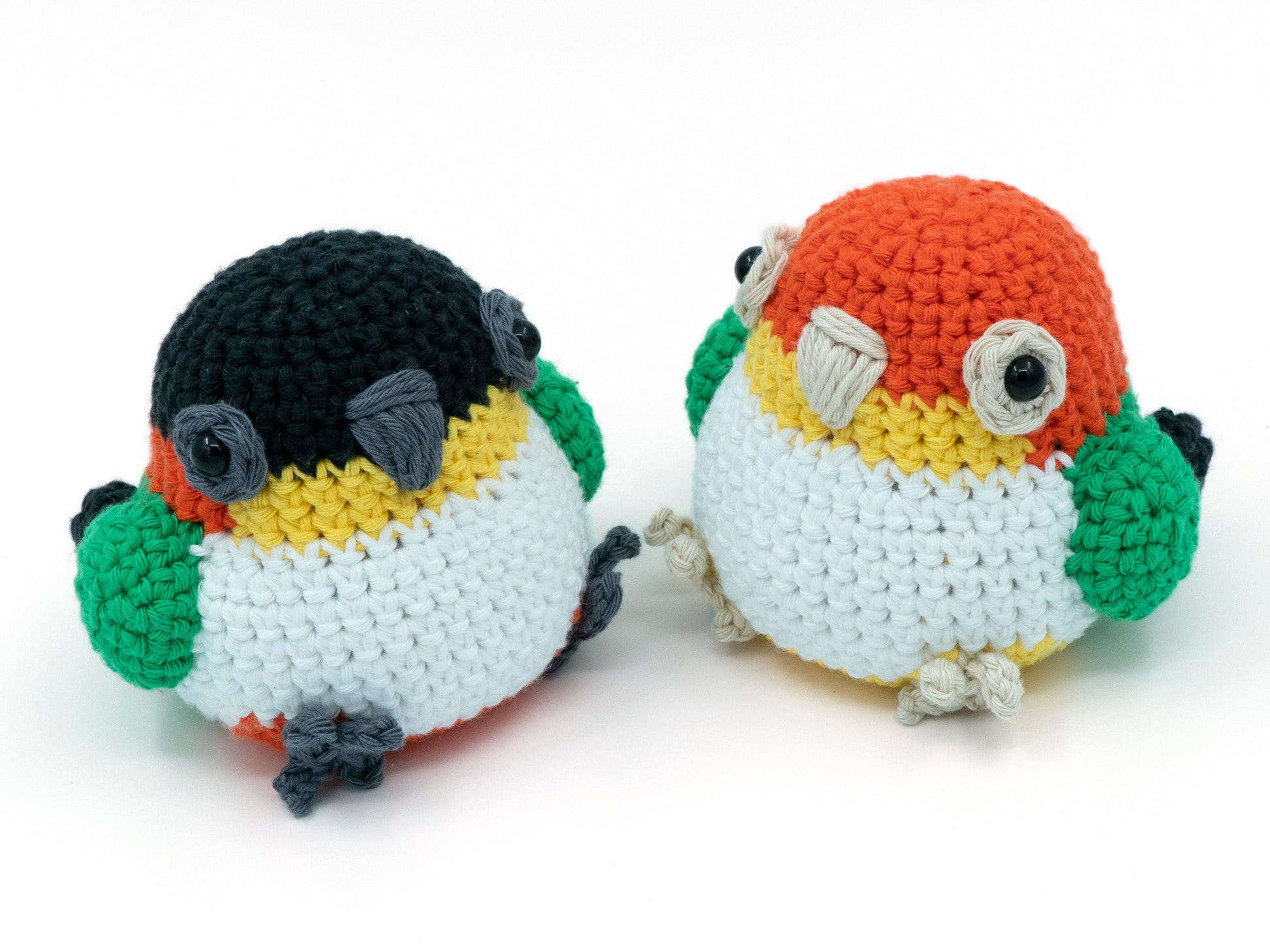 amigurumi crochet caique pattern black and yellow headed sitting next to each other