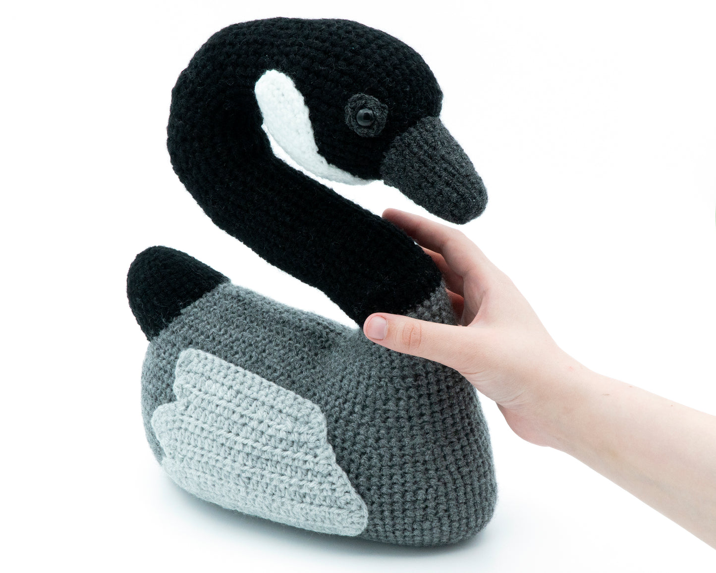 amigurumi crochet canada goose pattern in hand for size comparison