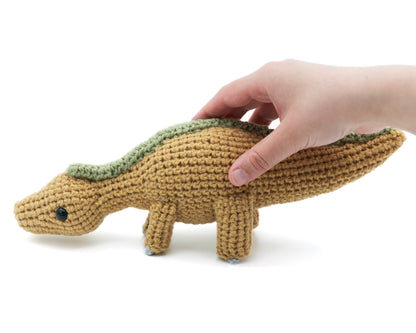amigurumi crochet maiasaurus dinosaur pattern in hand for size comparison