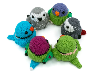 amigurumi crochet parrot pattern bundle with african grey plum-headed parakeet and indian ringneck sitting in a circle