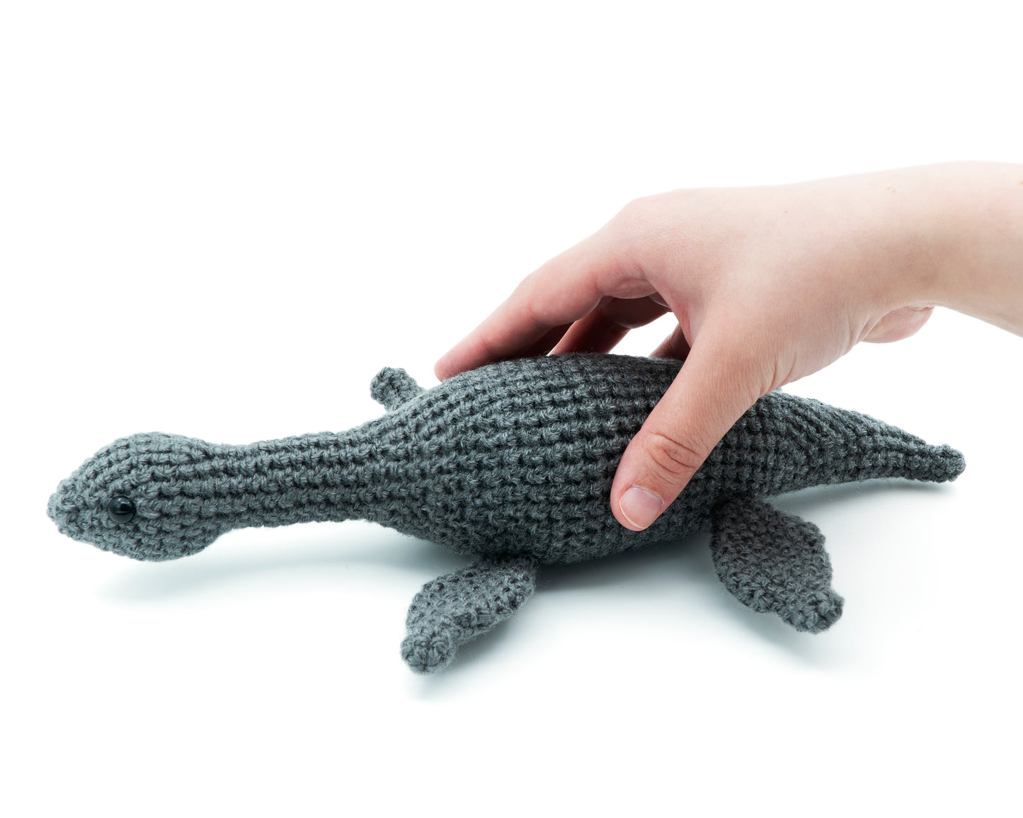 amigurumi crochet plesiosaurus pattern in hand for size comparison