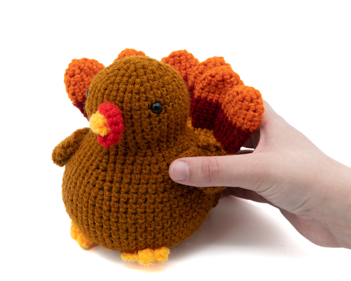 amigurumi crochet turkey pattern in hand for size comparison